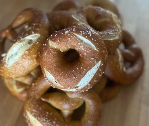 Rolling pretzel dough into shape